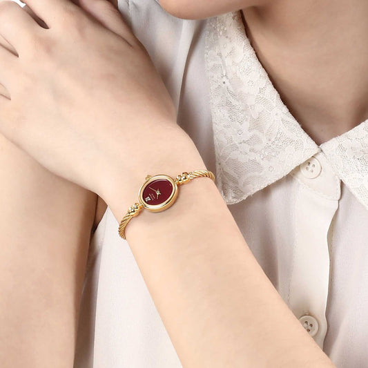 Titan Raga Women's Watch Analog Red Dial with Gold Stainless Steel Band, 197YM02