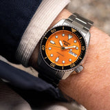 Seiko 5 Men's Automatic Watch Analog Orange Dial with Black Stainless Steel Band, SRPK35K