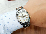 Seiko Men's Mechanical Watch Analog, White Dial with Two Tone Stainless Band, SNKL57K