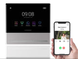 Smart home control panel with screen displaying icons and a smartphone showing a video call interface.