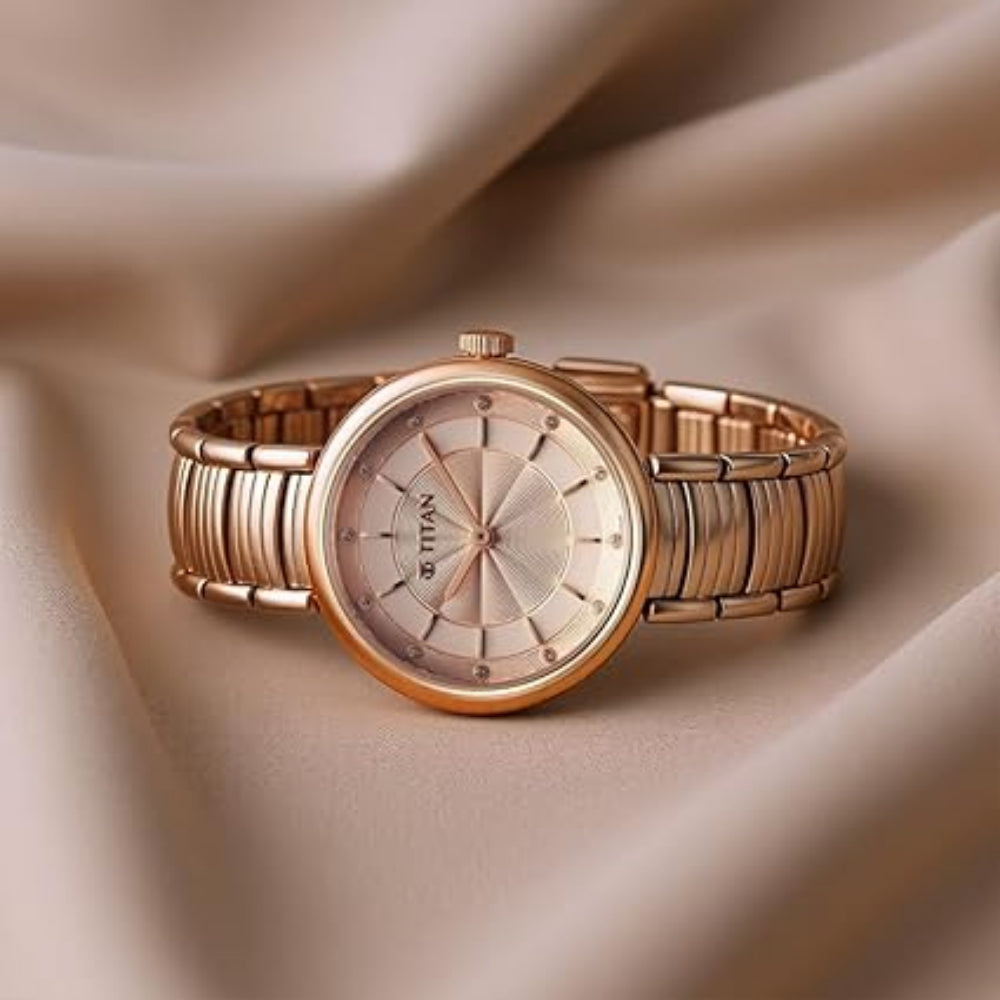 Titan Aura Quartz Analog Rose Gold Dial Rose Gold Stainless Steel Strap Watch for Women 95240WM01