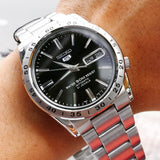 Seiko Men's Mechanical Watch Analog, Black Dial with Silver Stainless Steel Band, SNKE01K